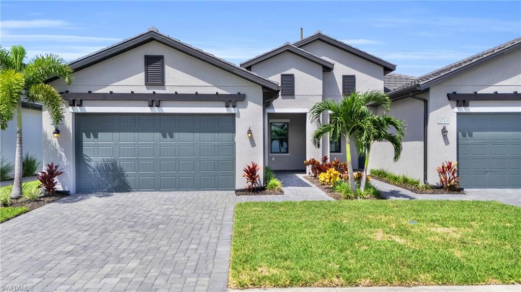 Welcome to Abaco Pointe by Toll Brothers. This charming attached villa offers a warm and inviting open single level floor plan, perfect for both relaxation and entertaining. With 2 bedrooms plus a den (could be used as an office/3rd bedroom), 2 full baths, and a direct-entry 2-car garage, you'll find plenty of space and comfort here. The villa features a screened-in lanai that opens to a private backyard—ideal for adding your own pool if you wish. Impact windows and doors enhance energy efficiency and provide a quiet interior environment. The kitchen boasts white shaker cabinets, upgraded lighting, and gas cooking, with a large center island with double sided cabinetry and additional seating- making it both stylish and functional. All appliances and blinds are included for a move-in-ready experience.The split floor plan offers privacy for guests, while the primary bedroom is a retreat with a spacious walk-in closet, an ensuite bath with a large walk-in shower, and views of the backyard. Whether you're upsizing, downsizing, or transitioning to Naples, this home can be perfectly suited to your needs. Abaco Pointe provides a resort-style pool, a well-equipped gym, and an amenities center. The location is incredibly convenient, with access to highly rated schools, shopping, dining, hospitals, and the Interstate—all within 20 minutes of the beach.