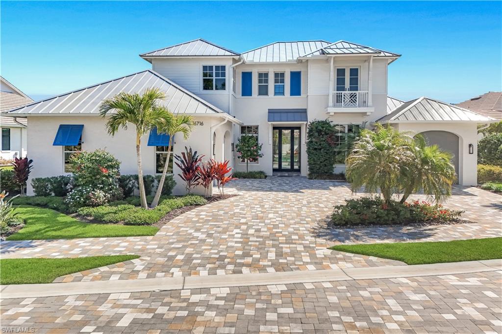 Immerse yourself in a lifestyle of elegance and serenity with this spectacular lakefront home in the heart of Naples. Situated within a prestigious gated community, this residence is surrounded by meticulously maintained landscaping, brick-paved streets, and a charming parklet, creating an inviting atmosphere at every turn. Expansive views of neighborhood lakes with fountains set a tranquil backdrop, while the private backyard retreat offers a sparkling swimming pool, soothing spa, outdoor kitchen, and ample space for entertaining or relaxing in privacy.

The interior is designed for both comfort and sophistication. The gourmet kitchen features high-end Viking appliances, custom wood cabinetry, and Pompeii quartz countertops, seamlessly connecting to the family room anchored by a warm gas fireplace. The main suite, located on the first floor, is a sanctuary of luxury with volume ceilings, a private sitting area, dual oversized walk-in closets, and a spa-inspired bathroom complete with a freestanding soaking tub, walk-in shower, and dual vanities. Additional first-floor spaces include a versatile den, an en-suite guest bedroom, a formal dining room, and a thoughtfully designed butler’s pantry.

Every detail of this home is crafted to elevate daily living while offering easy access to the best of Southwest Florida. Whether it’s relaxing by the pool, entertaining in style, or exploring nearby Gulf beaches, Mercato, fine dining in Naples and Bonita Springs, or convenient travel via SWFL International Airport, each day brings new opportunities for enjoyment. Welcome to the pinnacle of lakefront living—a 2024-built residence where sophistication, comfort, and a vibrant Florida lifestyle converge.