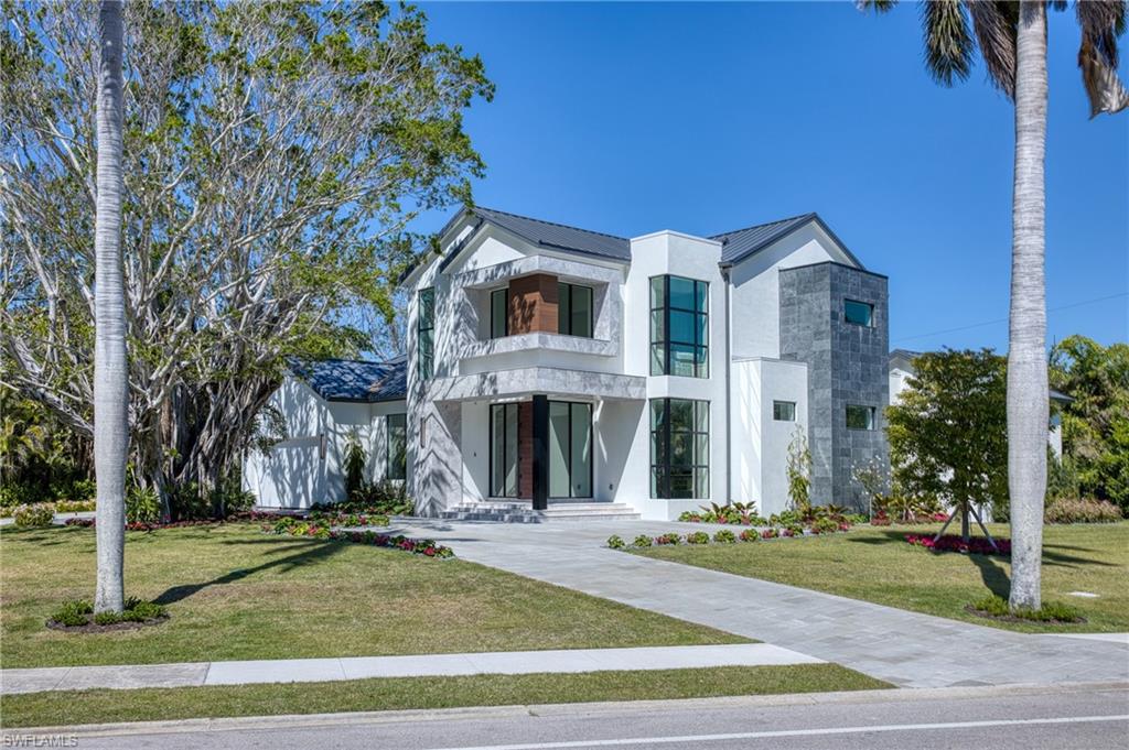 Prime Location Meets Modern Luxury in Coquina Sands Situated on a desirable corner lot in the prestigious Coquina Sands neighborhood, 1800 Crayton Rd offers the ultimate Naples lifestyle. Located just moments from pristine beaches, Lowdermilk Park, and the vibrant shopping and dining of Fifth Avenue, this 2024-built estate combines convenience, elegance, and modern luxury. Property Highlights: • Bedrooms/Bathrooms: 4 spacious bedrooms, each with an en-suite bath, an additional flex room which can serve as an office or additional guest/5th room also with its private bathroom; an additional powder room and pool bath, offering a total of 7 bathrooms. • Living Spaces: A thoughtfully designed open-concept layout with expansive living areas perfect for entertaining or relaxing. • Chef’s Kitchen: Featuring custom Italian cabinetry, state-of-the-art Wolf appliances, and premium finishes, this kitchen is as functional as it is beautiful. • Outdoor Retreat: Step outside to your private oasis featuring a sparkling pool and spa, a summer kitchen, a cozy outdoor fireplace, and beautifully landscaped surroundings. • Garage: A spacious 3-car garage provides ample room for vehicles and storage. Why You’ll Love This Home: This brand-new masterpiece blends modern elegance with timeless design, boasting high-end finishes, energy-efficient features, and luxurious outdoor spaces. Its prime corner lot location in Coquina Sands ensures you’re close to top-rated schools, tree-lined streets, and all that Naples has to offer.