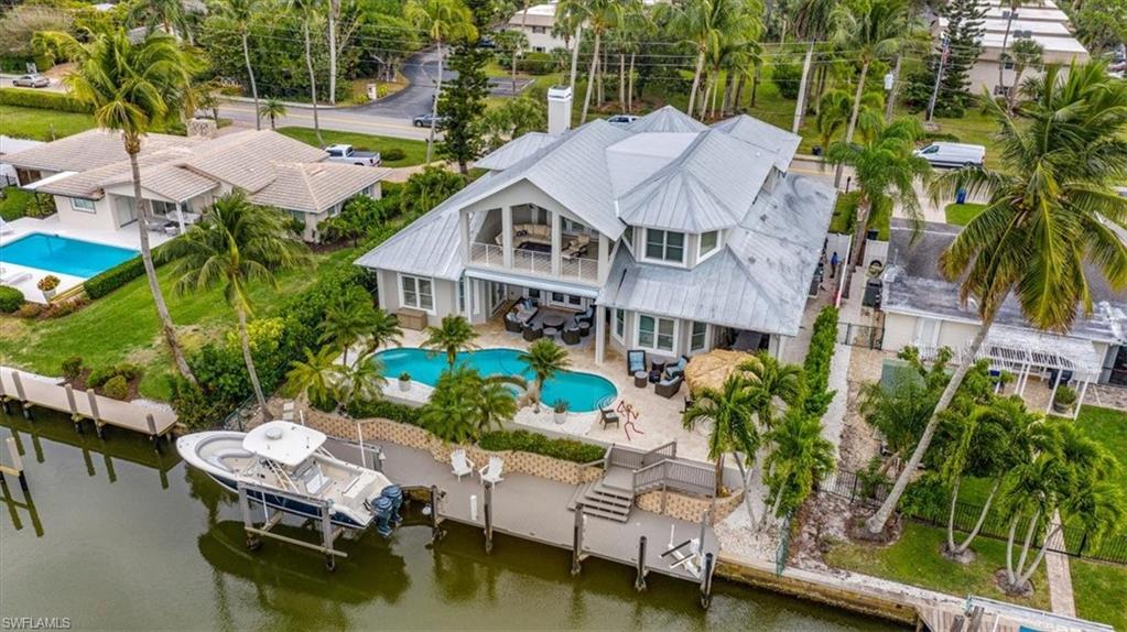 Ideal location in the sought-after boating community of Royal Harbor! Enjoy gorgeous sunsets with western exposure from the expansive lanai, which provides plentiful outdoor living space overlooking the beautiful pool and spa and your own tikibar. Boaters will love the 65 foot boat dock with 12,000 pound boat lift and jet ski lift providing direct access to Naples Bay and the Gulf of Mexico. Residence has been masterfully renovated inside and out showcasing beautiful plantation shutters and a split bedroom floor plan that features an overall unique layout. All just a short distance from downtown Naples’ world-class shopping, fine dining and white-sand beaches.