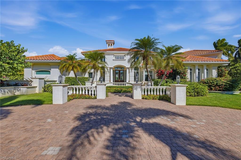 Elegant and refined Bay Colony Shores lakefront estate home on a prime corner lot offering unmatched privacy and peacefulness. With an updated interior featuring chef's kitchen, marble countertops, Wolf double wall oven, Sub-Zero refrigerator freezer, Lauriermax quiet close custom cabinetry, pot filler, center island and large walk-in pantry. Designer features include marble tile flooring, cabinet lighting, tasteful window treatments and custom molding. Family and guests will enjoy the abundant living area and privacy in the four additional guest bedrooms and bonus room upstairs. The screened-in pool and lanai area allow for peaceful and private enjoyment of your outdoor surroundings all year. With three-car air-conditioned garage spaces, manicured landscaping and two propane gas tanks, and a whole home generator offering additional peace of mind. Enjoy some of the best Naples has to offer with an unmatched gated and private lifestyle.