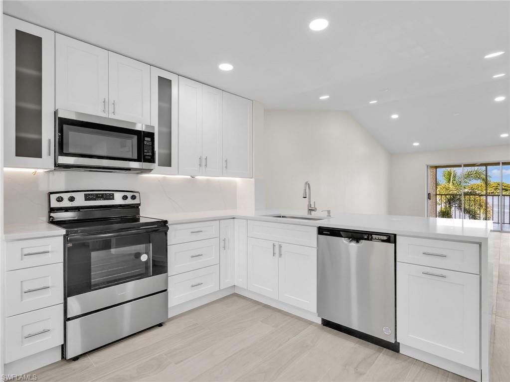 Welcome to this FULLY RENOVATED condo offering tranquil lake views and an exceptional North Naples location. Nearly every inch of this home has been thoughtfully updated, delivering a modern, move-in-ready space perfect for year-round living, a seasonal retreat, or a savvy investment.

The fully remodeled kitchen serves as the heart of the home, featuring new cabinetry, countertops, LED lighting, a convenient countertop power outlet, and brand-new appliances — including the range, microwave, and dishwasher. Recessed lighting flows throughout the entire residence, creating a bright and inviting atmosphere in every room.

Both bathrooms have been extensively upgraded with stylish finishes and smart conveniences. The guest bath showcases a fully remodeled glass-enclosed walk-in shower with premium fixtures, LED-lit shower niche, illuminated step accent, smart mirror, and smart toilet. The primary bathroom features a double-sink vanity and smart toilet upgrade. Custom laundry room cabinetry and a brand-new water heater round out the impressive list of improvements.

Enjoy peaceful lake views from your private lanai while being just minutes from Naples' most sought-after destinations — Gulf beaches, Seed to Table, North Collier Regional Park, Mercato, and premier shopping and dining. Fully renovated condos in this location rarely come available. Schedule your showing today before it's gone.