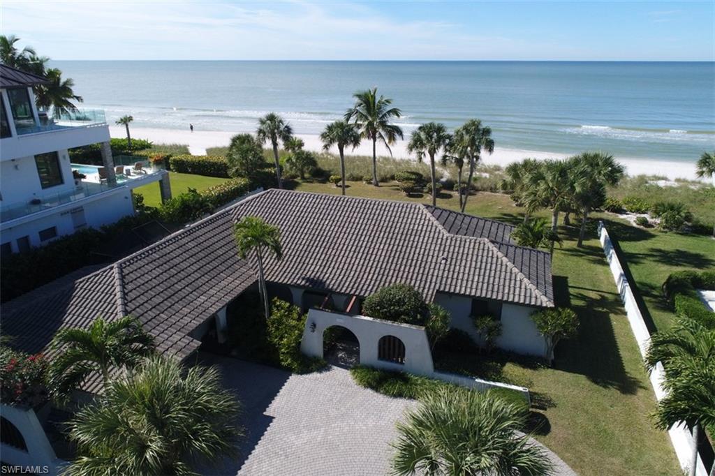 Rarely available beach front site (as-is home included.) 1 of only 13 single family properties on Vanderbilt beach. Located on the southern portion of this small string of homes. Incredibly desirable property that is ready for you to design your dream home. This boutique Vanderbilt Beach community is increasingly one of Naples most rarely available and coveted locations. The sugar sand beach is fantastic with no HOA, walk to the Ritz Beach Hotel & Spa, Convenient to Mercato dining & entertainment, Coconut Point Mall, and Downtown Naples. Also a short drive to the international airport. This site can accommodate a 10,000+ ac sqft and 15,000+ total sqft elevated pool home. Call for Details!