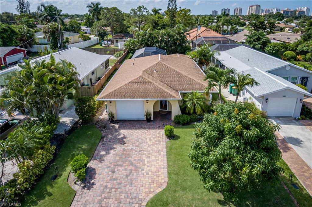Great Naples Park Home with a Pool. This property features 3 bedrooms and 2 full bath. Lush landscaping, 6ft trek privacy fence, whole house generator. Brick pavers, tile on diagonal irrigation on well. Great weekly rental income. Tenants rights for 2019-2020 seasonal renters already booked.