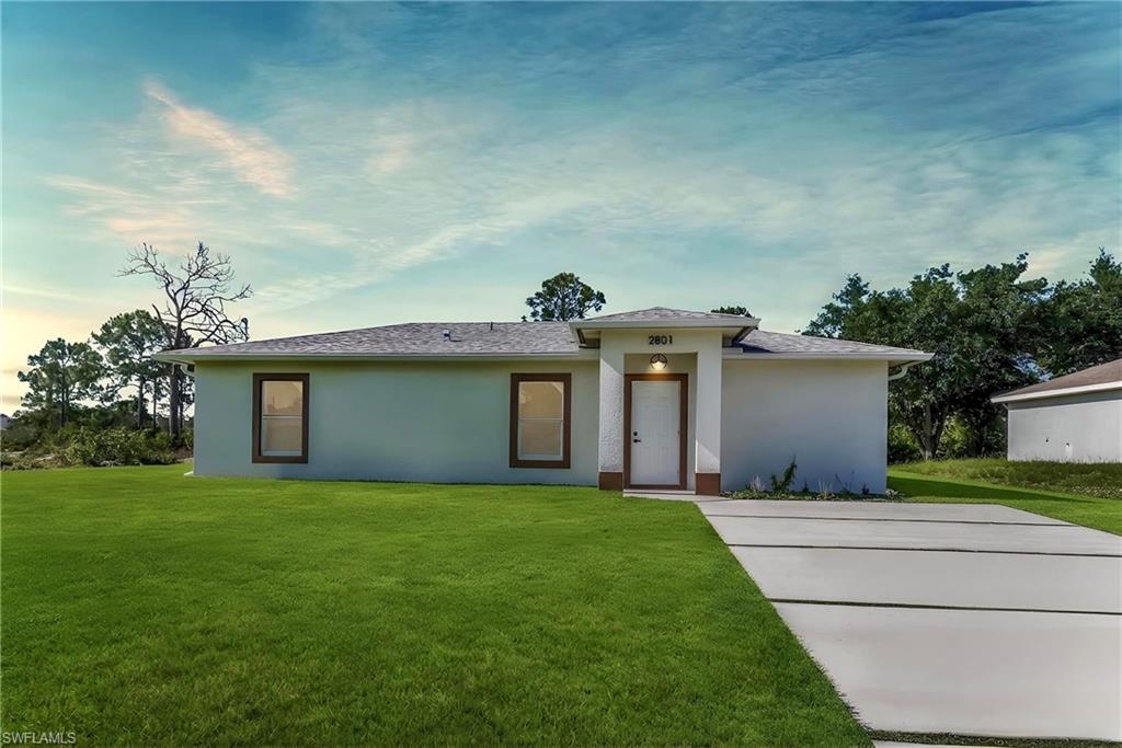 Welcome to this move-in ready MAGNIFICENT (2025) 3/2 home nestled away on a quiet street in the highly desirable west side. This split floor plan spotlights enticing oversized porcelain tile, admirable QUARTZ countertops, soft-close SHAKER cabinets, ZEBRA window treatments, and STAINLESS STEEL appliances. This modern design also highlights an attractive accent wall with TV, IMPACT windows and doors, premium fixtures, recessed lighting, an impressive FRAMELESS glass-tiled shower with a built-in niche and rainfall shower head, upgraded hardware, a desirable WALK-IN closet, laundry under air with a HIGH-EFFICIENCY washer and dryer, custom mirrors, HIGH SPEED internet, an irrigation system, and a covered back patio with pavers that is great for entertaining! Just minutes from all major amenities and a quick commute to Fort Myers. Schedule your showing today!