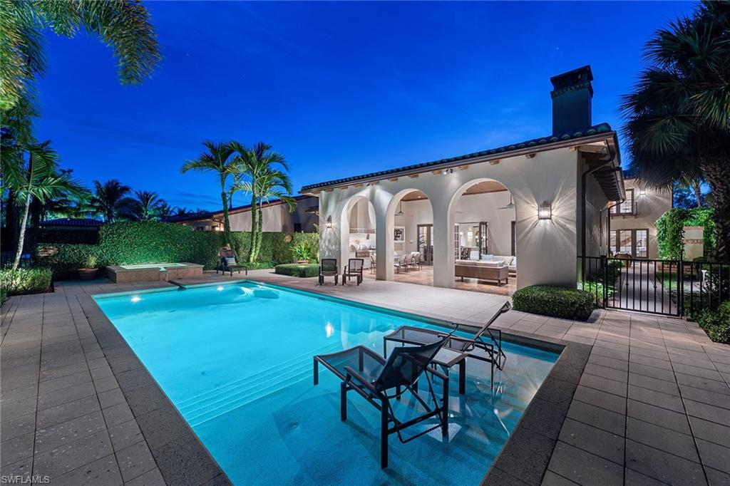 Immediate Golf Membership Opportunity is Available.  This spectacular one-of-a-kind home includes exceptional details.  This home was designed to take advantage of the sweeping views of Mediterra North's first fairway front the rear of the home as well as the privacy of the protected preserve along the length of the home. Custom details can be found throughout this light-filled home. Retreat to the luxurious master suite with custom closet spaces, a morning bar, and spa bath featuring a hidden television behind the vanity mirror and private patio. Multiple rooms wrap around the interior courtyard set along the preserve creating an intimate and welcome space featuring a brick detailed fireplace, potted plants and vines. The outdoor living space at the rear is the perfect escape. A wall detailed with brick and vines offers privacy whether swimming in the pool, enjoying the spa or grilling at the spacious outdoor living area. Other details include beamed ceilings, a gourmet kitchen, custom cabinetry, Lutron lighting system, motorized shades, a full house generator and more exquisite touches. Located in the award-winning community of Mediterra, this home is a true work of art.