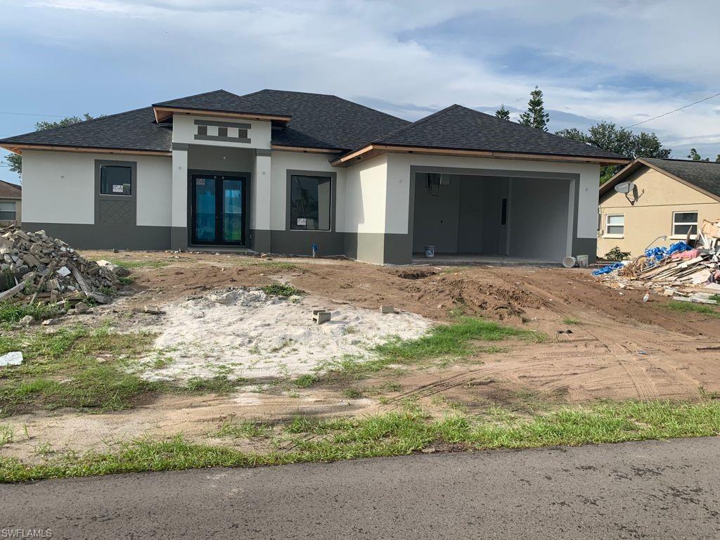 Currently Under Construction!!! 3 bedroom, 2 BATH with LARGE TWO CAR GARAGE! FANTASTIC Cape Coral location Porcelain TILE flooring. OPEN to the large DINING ROOM. IMPACT doors and windows! PLENTY of room for a pool. Close to schools, shops, and several parks, Just a few minutes of everything. Best location  in Cape !!!!!!!