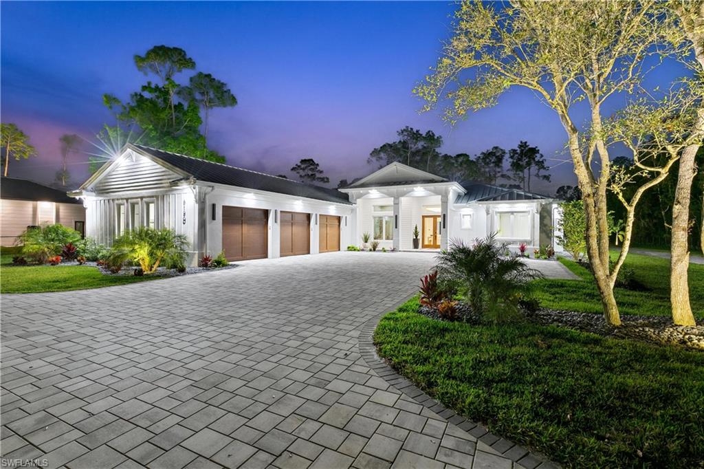 TIMELESS LUXURY AND ELEGANCE! No expense has been spared with this home's quality and finishes and it exudes extraordinary design. This single story custom construction home includes a metal roof and gutters, triple windows with transoms, spray foam insulation, solid core 8 foot interior doors, a 500 gallon propane tank and generator hookup. This home is meant to be enjoyed - both indoors and out! Built in 2023 on 2.73 acres, this spacious 4 bed + large den/5 bath 3,950 sqft home has numerous exquisite features and custom details such as the beautiful and warm Duchateu European Oak engineered flooring, Sonos speaker system and a safe room. The open-concept kitchen with Cristallo Extra Quartzite countertops backlit with LED lighting, high-end Miele appliances including a Coffee System, steam oven, wall oven, built-in dishwasher, Monogram cooktop, Sub Zero refrigerator, and custom cabinetry from New Style cabinets. Living room is accented by Cristallo Extra Quartzite slabs with full LED light panels behind the 85" Samsung “The Frame” TV with Sonos sound bar system, custom made TV cabinet. Formal dining room is accented by custom made table, and is situated overlooking the pool. Dry bar with backlit Cristallo Extra Quartzite features a Zephyr wine cooler with custom panel and color changing LED control. Spacious, private owner's suite on one side of the home with a seating area and doors leading out to the lanai and pool area, soaring ceilings, huge windows for natural light, and a Fort Knox safe door on the walk-in closet. Owner's private bath has plain sawn walnut cabinets, Mystery White Leathered Marble slabs for the flooring, vanities and shower. Shower walls are backlit with color changing LED lighting, a Baril shower system with 3-spray shower bar, shower head with 3-way controls, and a ceiling shower head. Oversized nature deck mount tub. Two additional bathrooms feature porcelain slab flooring and walls with no seams, Kallista sinks, Fantini and Foster faucets and wall-hung toilets. Powder bath has stunning precious stone natural agate flooring and custom sink backlit with LED lighting, custom wallpaper and wall-hung toilet. Pool bath has porcelain flooring, Cristallo Uzul Quartzite on the back wall, Lacava vanity and faucet, and wall-hung toilet. Outdoor living was just as thoughtfully designed with an in-ground pool/spa, screened lanai and a fully equipped outdoor kitchen with Naturkast outdoor cabinets and porcelain mitered countertops, 42" propane grill, stainless steel range hood and appliances; and a separate seating area with Napoleon fireplace and “Sony 75” TV with Sonos sound bar. Lot is fully cleared and fenced with a custom gate. Additional 1,950 sqft metal building has electricity and can be used as a workshop, garage, or extra storage. A fire pit patio area with seating extends your outdoor enjoyment. Landscaping is enhanced by approx. 12,000 sqft circular paver driveway, fruit trees, shrubbery and custom landscape lighting.