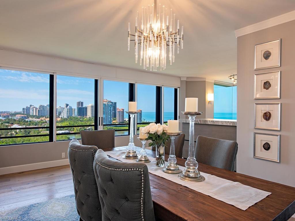 C.16050 - This is THE HERON JEWEL you’ve been waiting for! This Totally Re-Mastered 15th floor gem boasts a thoughtfully redesigned floor plan focused on maximizing Heron’s already renowned unobstructed views of The Gulf, Clam Pass, and the shimmering lights of Park Shore to the south. Stunning Palermo Bellacita wide-plank wood flooring throughout sets the backdrop for all the rest of the bells and whistles, including crisp white custom cabinetry, Quartzite Super White countertops, Sub-Zero refrigerator, Viking French-door double ovens, Wolf induction cooktop and hood, Bosch dishwasher, gathering hi-bar with leathered granite countertop, wine chiller and ice maker. Master and Guest Bedrooms both offer daring zero-corner mitered glass window walls and plush baths designed to pamper! Heron is a boutique Hi-Rise Tower of just 40 owners, and a mere 2 residences per floor, each offering corner wrap-around views,  and is now proud to showcase its just unveiled 2019 clean and chic welcome lobby and social salon! Enjoy all the included Pelican Bay membership privileges of two Gulf-Front Beach Clubs!