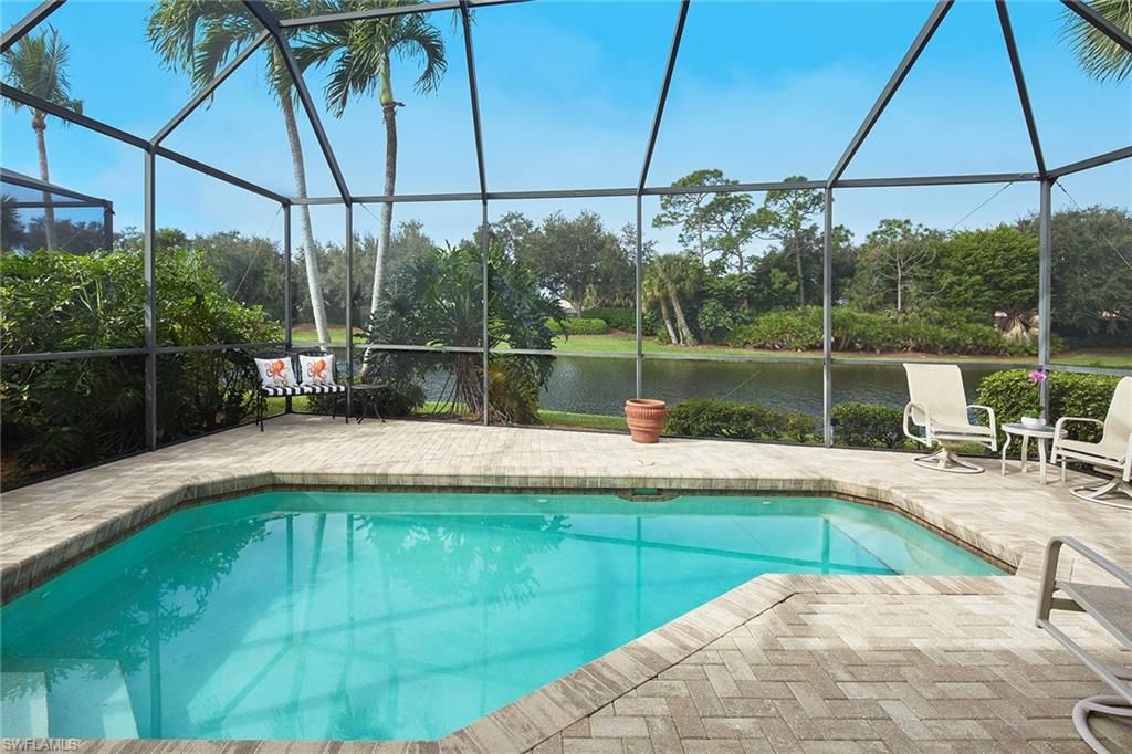 Presenting a stunning one story home situated on a lakefront lot to capture sparkling views in Troon Lakes. A wall of sliding glass doors in the spacious great room allows for wonderful light with views to the pool, large covered lanai and lake beyond. This home is immaculate with an open kitchen that has wood cabinetry, granite countertops and stainless steel appliances with a cozy breakfast area. The private master suite includes an updated bath with walk-in shower, spacious walk-in closet and tray ceiling details. The den/study is situated off the great room with access to a full bath and the guest suite features a private bath and large closet. Pelican Marsh has 133 acres of nature and miles of pathways, features a full-service fitness center, bocce ball, very active tennis program and optional golf memberships to the Pelican Marsh Golf Club. The North Naples location is very close to upscale dining, shopping, Mercato, Waterside Shops, Artis-Naples and the beautiful white sandy beaches.