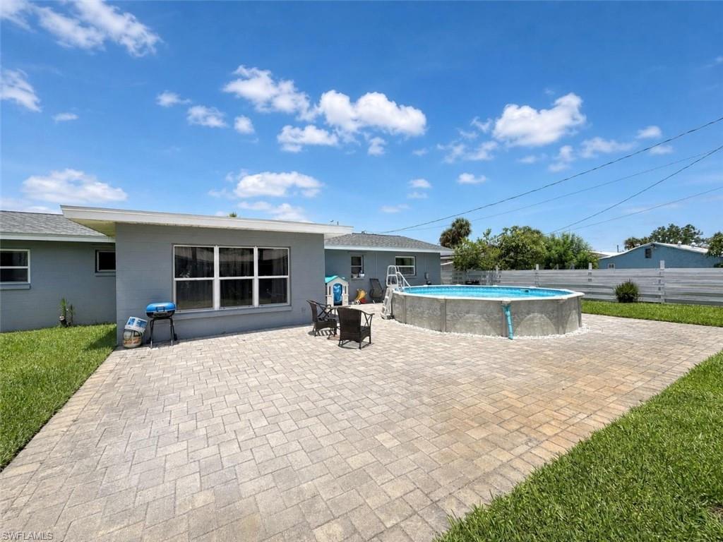 Welcome home to this beautifully updated 3-bedroom, 2-bath residence nestled on a spacious lot in the heart of Lehigh Acres. Combining modern updates with timeless charm, this move-in-ready home offers the perfect blend of comfort, style, and outdoor living.

From the moment you arrive, you'll appreciate the home's inviting curb appeal and meticulously maintained condition. Inside, you'll find a bright, open layout featuring luxury vinyl plank flooring, fresh neutral colors, updated lighting, and an abundance of natural light throughout.

The remodeled kitchen is the heart of the home, boasting stylish shaker cabinetry, granite countertops, a designer tile backsplash, stainless steel appliances, and plenty of cabinet and countertop space for everyday living and entertaining.

The spacious living area flows seamlessly into an oversized bonus/family room that offers endless possibilities—create the ultimate media room, game room, home office, fitness area, or additional entertaining space.

The generously sized primary suite and guest bedrooms are beautifully finished with updated flooring and modern ceiling fans, while the updated bathrooms feature contemporary vanities and fixtures that provide a clean, fresh feel.

Step outside to your own private backyard oasis. A stunning paver patio surrounds the sparkling above-ground pool, creating the perfect setting for relaxing Florida afternoons, weekend barbecues, or entertaining family and friends. The fully fenced backyard provides privacy with plenty of room for children, pets, gardening, or future outdoor enhancements.