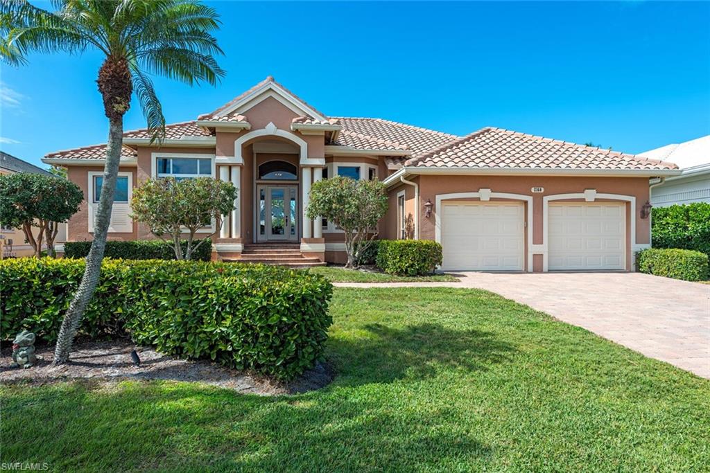 Welcome to your ideal waterfront retreat.  This stunning home offers a unique blend of luxury and functionality, perfect for boating enthusiasts. With 98 feet of prime water frontage on deep water canal and desired western exposure, enjoy breathtaking sunsets right from your backyard.

This property features two boat lifts — a 24,000 lb lift and a 4,500 lb lift — providing convenient access to the open waters of Naples Bay, just three houses in from Haldeman Creek and free from any bridge obstructions to the Gulf.

Step inside to discover a spacious open floor plan bathed in natural light, showcasing 11-12’ ceilings that enhance the sense of grandeur. The thoughtful design includes three bedrooms plus a versatile den, offering ample space for family and guests.