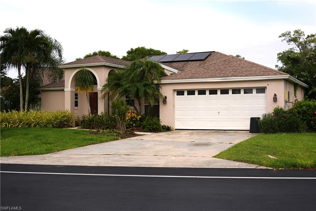 Beautifully maintained 3-bedroom, 2-bathroom pool home located in the highly desirable gated community of Moon Lake. Featuring a split-bedroom floor plan, 2-car garage, covered lanai and numerous updates throughout, this home offers comfortable living both inside and out while helping reduce energy costs.

The spacious kitchen is equipped with rustic concrete countertops, stainless steel appliances, ample cabinet storage, and bar seating, making it ideal for everyday living and entertaining. The open-concept layout, high ceilings, and large sliding glass doors fill the home with natural light and create a seamless connection to the outdoor living space.

The primary suite includes a walk-in closet, private access to the lanai, and an updated ensuite bathroom with dual vanities and a walk-in shower. Both bathrooms have been remodeled within the last two years.

Step outside to enjoy the screened pool area, expansive patio, and outdoor kitchen complete with a grill, sink, and bar seating under the gazebo; perfect for relaxing or hosting family and friends.

Additional features include rooftop solar panels that provide increased energy efficiency and help offset utility costs, adding long-term value and sustainability to the home.

Moon Lake residents enjoy access to a heated community pool, clubhouse, and tennis courts. Conveniently located within 15 minutes of Naples beaches, the Naples Zoo, shopping, dining, parks, schools, and healthcare facilities, this home offers the perfect balance of privacy, community amenities, and easy access to everything Naples has to offer.