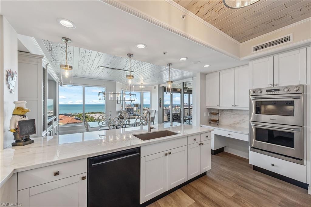 Gorgeous high-floor three-bedroom-plus-den, three-and-a-half-bath Gulf-view designer renovation with custom finishes and upgrades throughout. Your private foyer welcomes you into an expansive living and entertaining space highlighted by designer light fixtures, custom ceiling trim and the finest decor choices. The renovated kitchen design features stainless steel appliances, smooth-close cabinetry and neutral soothing solid surface countertops. The spa-inspired primary bath features an oversized shower, dual vanities and professionally designed lighting and a separate standalone soaking tub. Your friends and family can enjoy maximum privacy in two spacious guest suites with en-suite baths. Trieste has completed refreshing upgrades to common areas and residents enjoy a geo-heated tropical pool, fitness room, social room, library and staffed front desk in the lobby. Experience Bay Colony and Pelican Bay beach clubs with attended beach services or work on your serve at Bay Colony Tennis Club.
