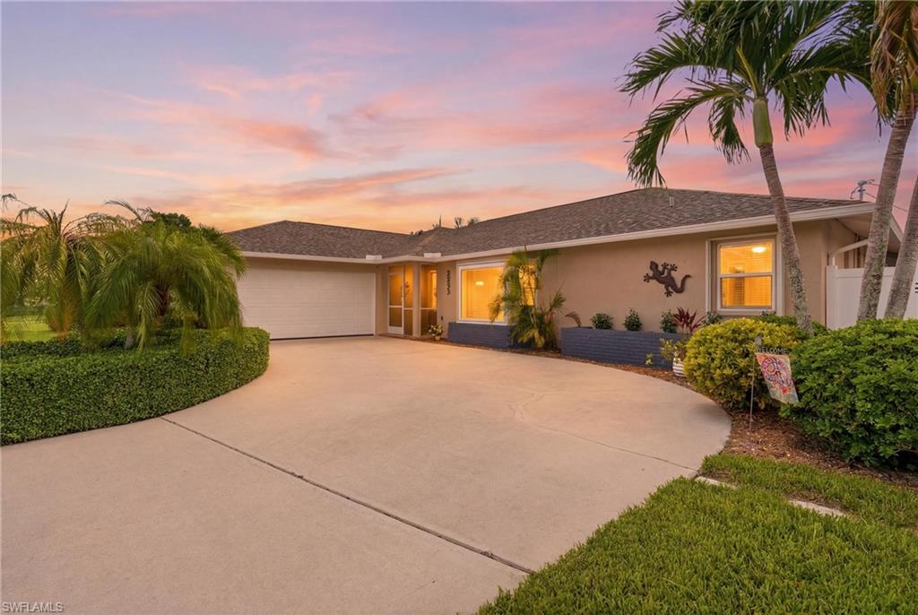 Beautifully Landscaped Pool Home in the Heart of SW Cape Coral!

Welcome to 2233 SW 12th Place, a 3 bedroom, 2 bath plus den home where modern updates, outdoor living, and an unbeatable location come together. Just one block from Palmetto Pine Country Club, this move-in-ready residence offers the perfect Florida lifestyle with a sparkling pool, expansive covered lanai, and a fully fenced, beautifully landscaped backyard designed for privacy, relaxation, and entertaining.

Inside, the completely remodeled interior features a stunning kitchen with cream white cabinetry, granite countertops, and Whirlpool stainless steel appliances. The same elegant finishes continue through the bathrooms and laundry room for a cohesive, upscale feel. The den, family room, and primary suite all feature impact-resistant glass, along with the kitchen, enhancing safety, efficiency, and peace of mind.

Luxury vinyl plank flooring runs throughout the entire home, complemented by 5-inch baseboards and crown molding in the living room. The spacious primary suite offers a large walk-in closet and pocket sliding doors leading directly to the lanai for seamless indoor-outdoor living.

Step outside to your private screened pool area overlooking lush, manicured landscaping—perfect for entertaining or enjoying Southwest Florida’s sunshine. Additional features include a Genalink portable generator hookup for storm season peace of mind.

Major updates include a new roof (2023), A/C (2020), impact windows and sliders in key areas, thermopane windows throughout, and a rescreened/painted pool cage (2022). water heater 2026, All city assessments have been paid. HVAC system with Halo air purification system for enhanced indoor air quality

Conveniently located near shopping, dining, golf, and schools, this beautifully updated home is truly move-in ready.