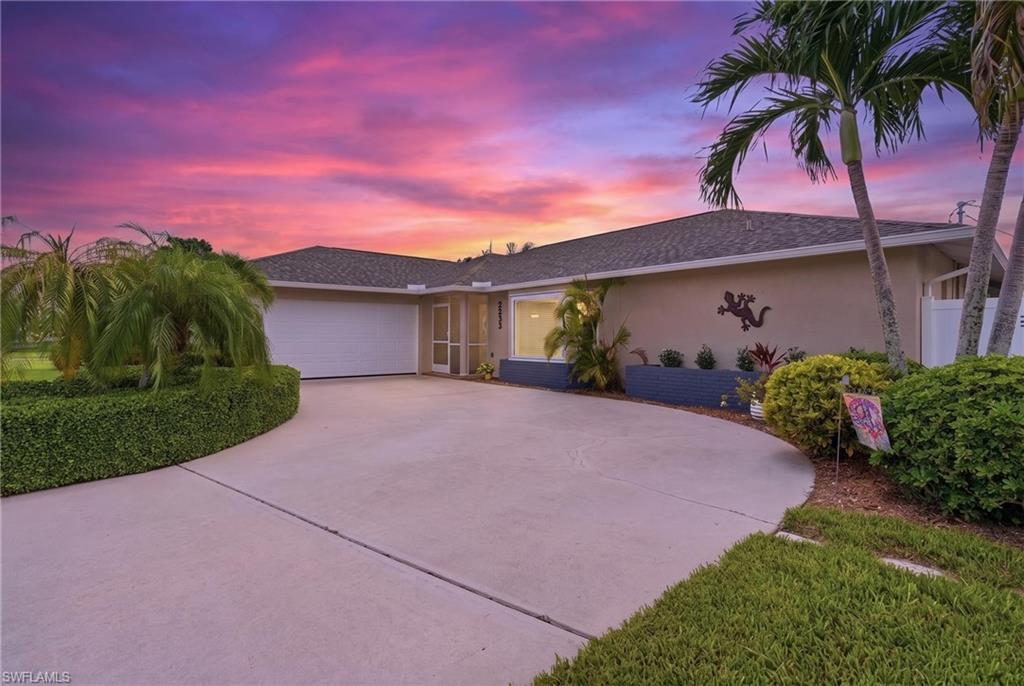 Beautifully Landscaped Pool Home in the Heart of SW Cape Coral!

Welcome to 2233 SW 12th Place, a 3 bedroom, 2 bath plus den home where modern updates, outdoor living, and an unbeatable location come together. Just one block from Palmetto Pine Country Club, this move-in-ready residence offers the perfect Florida lifestyle with a sparkling pool, expansive covered lanai, and a fully fenced, beautifully landscaped backyard designed for privacy, relaxation, and entertaining.

Inside, the completely remodeled interior features a stunning kitchen with cream white cabinetry, granite countertops, and Whirlpool stainless steel appliances. The same elegant finishes continue through the bathrooms and laundry room for a cohesive, upscale feel. The den, family room, and primary suite all feature impact-resistant glass, along with the kitchen, enhancing safety, efficiency, and peace of mind.

Luxury vinyl plank flooring runs throughout the entire home, complemented by 5-inch baseboards and crown molding in the living room. The spacious primary suite offers a large walk-in closet and pocket sliding doors leading directly to the lanai for seamless indoor-outdoor living.

Step outside to your private screened pool area overlooking lush, manicured landscaping—perfect for entertaining or enjoying Southwest Florida’s sunshine. Additional features include a Genalink portable generator hookup for storm season peace of mind.

Major updates include a new roof (2023), A/C (2020), impact windows and sliders in key areas, thermopane windows throughout, and a rescreened/painted pool cage (2022). water heater 2026, All city assessments have been paid. HVAC system with Halo air purification system for enhanced indoor air quality

Conveniently located near shopping, dining, golf, and schools, this beautifully updated home is truly move-in ready.