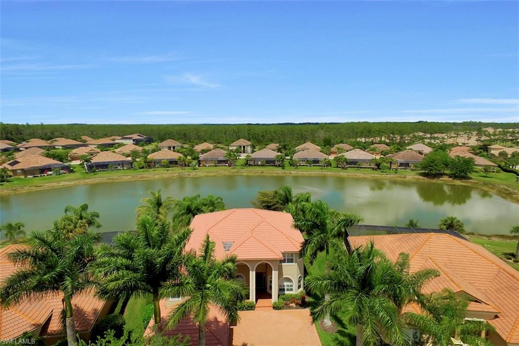 This featured Estate Pool Home is the former Lennar Model of the Colonade Grande located in the ESTATES section of Bella Terra. It is situated on an oversized premium lot w/spanning lake view. Rich appointments such as custom tile & rich wood cabinetry finishes, beautiful Tuscan Mediterranean influence, Plantation shutters, outdoor kitchen, the list goes on....
 The entire 1st floor is tiled & features a separate bedroom/full bath. Master & remaining bedrooms are upstairs. THE ENTIRE 2ND FLOOR OF THIS HOME OPENS ON TO SCREENED LANAI, GIVING YOU BEAUTIFUL VIEWS OF THE LAKE. 4,000 sq ft of living space, 5 bedrooms, Den, 4 baths, family room, living room & a MEDIA ROOM with surround sound, 4-Car garage, bonus room & a loft. One of the most desirable street in the community! Bella Terra amenities offer something for everyone: clubhouse with resort style pool and spa, exercise room, tennis and pickleball courts, volleyball, basketball, bocce ball, skating rink, soccer and baseball field! All of this and more for low association fees!!