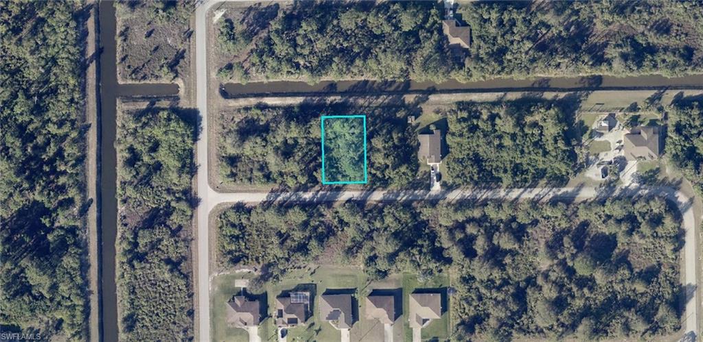 One or more photo(s) has been virtually staged, AI generated or rendered.  Waterfront Canal lot in the SE area of Lehigh, make it a double as next door, #1111 Artic is also for sale, same terms, same seller. No HOA here. Whether you’re building now or holding for the future, this location delivers the perfect blend of tranquility, convenience, and long-term upside. Waterfront Canal Lot Enjoy a serene freshwater canal right in your backyard — perfect for added privacy, scenic views, and a more desirable homesite. Waterfront lots consistently attract stronger buyer interest and long-term value. High-Growth Residential Area Surrounded by new construction and ongoing development.