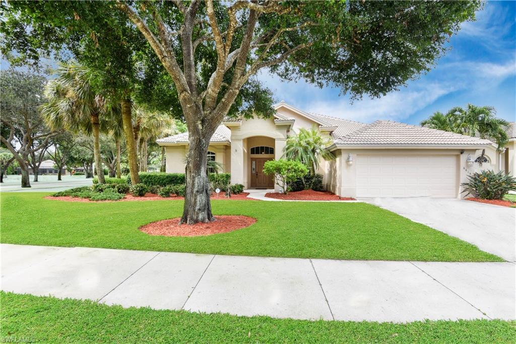 Stunning renovations offered in this gently lived in Autumn Woods treasure! BRAND NEW ROOF! Situated on an over-sized corner lot, surrounded by mature tropical landscaping, this home boasts fantastic outdoor living space with a heated, salt-water pool & spa. You will love spending time on the extended lanai featuring an under truss area, pool bath, and lake view. The interior features 2,800 sq ft under air with a split bedroom design and family/living room layout. Enjoy the spacious kitchen and formal dining area perfect for entertaining. Gorgeous wood flooring in bedrooms and tile throughout the main living areas and bathrooms. Guest bedrooms are equipped with custom cabinetry for closets and the master has a custom built walk-in closet system. The remodeled bathrooms look as though they should be featured in a design magazine with the master bath having a dual sink vanity, extra large soaking tub, frame-less glass steam shower with multiple shower heads, remote control toilet and a bidet. You will find plantation shutters throughout and an expanded two-car garage with epoxy flooring. This home is a RARE find and has been meticulously cared for by the current owners.