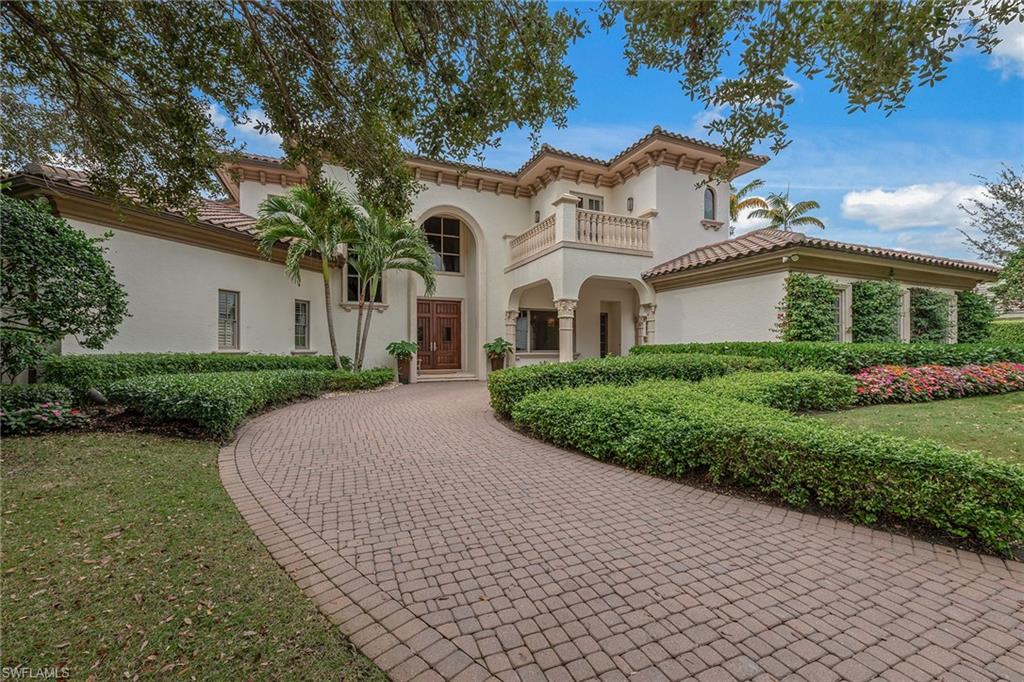 Elegant and graceful estate home behind the secure gates of the prestigious Bay Colony Golf Estates neighborhood. With a prime and serene lot expansive location offering gorgeous open views of the Bay Colony Golf Course and lush tropical landscaping abound. This desirable lifestyle, rich floor plan features designer details such as soaring ceilings with craftsman moldings and trim, an entertaining bar, chef's kitchen with six-burner gas cooktop, Sub-Zero refrigerator freezer, Wolf wall oven, custom built in's, an outdoor bar complementing a large outdoor private seating area, sparkling pool and hot tub, convenient guest house, two wine coolers, dual offices, outstanding golf course views, southwest rear exposure and three-car plus garage. Residents enjoy all the benefits of Bay Colony Beach Club and tennis club. Private Bay Colony Golf Club membership is available separately.