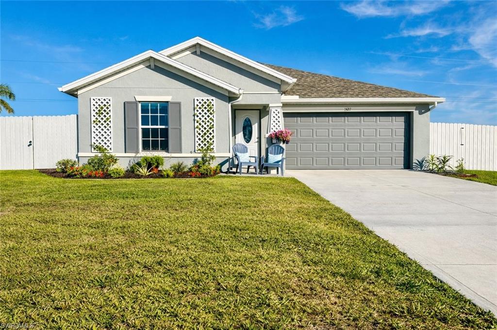 New build with all the updates and a fully fenced yard. Spacious inside and privacy outside. This 2024 home has a perfect lot and features a beautiful garden and a private outdoor setting ready to be enjoyed from day one. Inside, an amazing open-concept kitchen and main living area form a bright, spacious center for everyday life. Quartz countertops, modern finishes, and a layout that flows easily into the living and dining spaces make this kitchen ideal for both daily living and entertaining. The large pantry offers generous storage and organization that keeps the space feeling open and uncluttered. Tall ceilings and tile flooring throughout bring a light, open, and welcoming feel to the home. The oversized primary bedroom provides a comfortable retreat, complete with a walk-in shower and a spacious layout. The secondary bedrooms are also generously sized, giving the home flexibility for family, guests, or workspace needs. With 1,556 square feet, three bedrooms, two baths, and a two-car garage, the home is well balanced and inviting. Outside, the fully enclosed yard with gated access offers a private space well suited for pets, gardening, and relaxed outdoor living. Located in non-HOA Cape Coral, this home offers modern comfort, privacy, and a truly move-in-ready lifestyle.