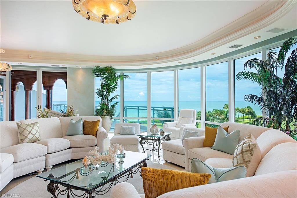 Best of all worlds. The extraordinary, expansive private terraces with access directly to the beach capture the ultimate beach-house lifestyle in one of the finest estate high-rise residential buildings in Naples. Savor the relaxing seaside setting in style with magnificent Gulf and bay views. Nestled into the lush tropical setting, the spacious interior features extensive custom architectural design masterfully crafted, encompassing approximately 7,800 square feet of perfection for gracious living and entertainment, including the terraces giving a total living area of approximately 8,860 square feet. Private access to the beach. Private three-car garage. Private elevator entry. Ultimate in privacy. Utmost in security. Unsurpassed amenities. All in the heart of the Gulf Shore.