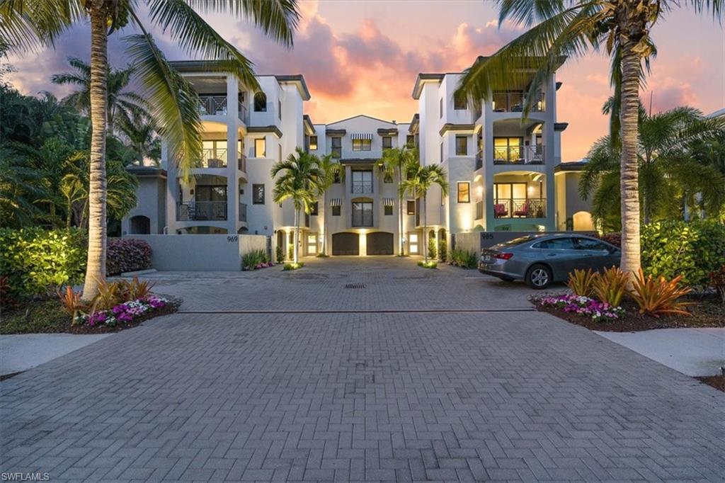 Enjoy penthouse living with single-family vibe in this exclusive enclave featuring only six one-level residences. Embark from the private elevator into open, airy haven of soft tones, wide oak-plank flooring, multiple balconies & windows to enjoy a 3rd floor treehouse-like perch w views of palm trees, courtyard, sunsets & sunrises. The main living area opens to outdoor space w southern exposure & the kitchen w white cabinetry, quartz counters, custom backsplash, Thermador appl & wine cooler. With an electric fireplace, comfortable furnishings & full dining area, this home is elegant & comfortable. The luxurious main suite offers a separate seating area, oversized bath w dual sinks, generous shower & Juliet balcony. Guest rooms are ensuite. Take the elevator to the secure lobby, enter the secluded PRIVATE lanai & pool area to enjoy lazy days & bbq’s. A 2-car garage w steel doors & epoxy flooring offers secure entry & add'l features incl custom shades throughout (some automated) w choice of sheer or blackout feature, lush landscaping, secure access by app & much more. Maintenance-free living offers you the freedom and time to walk to beaches, shopping, dining & more.