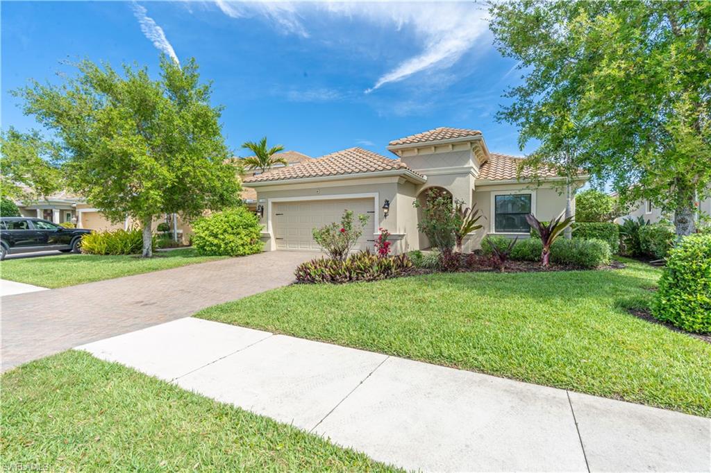 Imagine stepping into one of the largest homes available in an exclusive gated retrieve in Naples, where luxury, privacy, and natural beauty come together effortlessly. This exceptional residence is designed to be filled with natural light, featuring expansive windows and open-concept living spaces that create a bright, airy atmosphere throughout. Soaring high ceilings and elegant architectural details elevate every room, giving the home a grand yet welcoming feel. At the heart of the home, you'll find a fully upgraded gourmet kitchen, complete with premium finishes, custom cabinetry, and a spacious walk-in pantry-perfect for both everyday living and entertaining. The bathrooms have been thoughtfully renovated with modern touches, offering comfort and sophistication in every detail. Step outside and you'll be greeted by a large covered porch (lanai) overlooking a peaceful pond, where you can unwind and take in breathtaking Florida sunsets-a defining feature of many luxury homes in this area . The seamless indoor-outdoor flow makes it ideal for relaxing evenings or hosting guests. The property is surrounded by lush, professionally designed landscaping, creating your own private tropical retreat-truly a slice of paradise. Located within a secure gated community, this home offers not just beauty, but convenience. You're just minutes from shopping, dining, entertainment, and waterfront activities, while still enjoying a quiet, upscale neighborhood atmosphere. Super low HOA that covers cable, irrigation, lawn/land maintenance, pest control exterior, sewer, common areas maintenance & professional management. This property is Not located in a flood zone, therefore it doesn't require flood insurance