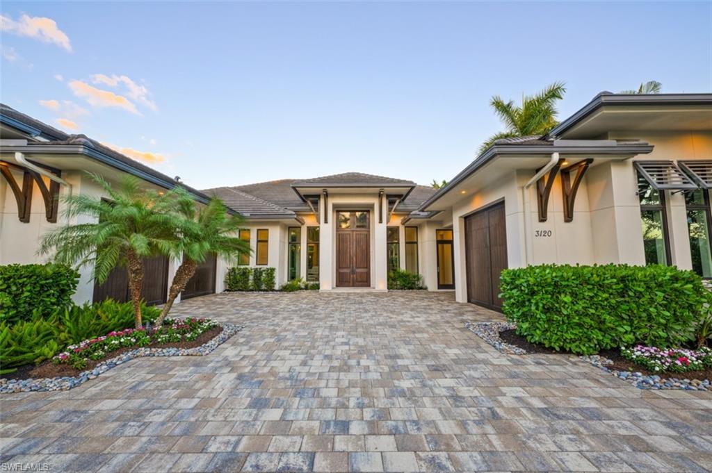 Exquisite residence is now available in the sought after community of the Moorings. This spectacular 5 bedroom 5.5 bath residence features a chef's kitchen with ample storage, built in pantry, oversized island with bar seating, and gorgeous countertops. Modern design & decor can be found throughout including high ceilings, gorgeous wood flooring, and unique architectural accents. The master retreat features custom closets & spa like bathroom ideal for relaxation. The well laid out floor plan allows easy access from the interior living space to the impressive outdoor living area, which capitalizes on beautiful views of the voluminous wood ceilings, captivating fireplace, and inviting pool and spa. All of this, just moments away from the vibrant downtown Naples, renowned shopping, gourmet dining, and pristine white-sand beaches.