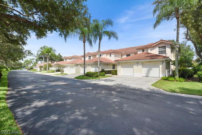 Feel right at home within the pristine community of Vineyards! Enjoy the spacious living with 3 beds, 2 full baths and an ATTACHED GARAGE while enjoying virtually maintenance free condo life. Convenience is yours here, located close to the gate, the pool, next to guest parking, the Vineyards Community Park, and just 2 miles to Publix grocery & Physicians Regional Hospital. Whether you're cooking, resting in the breakfast nook, or reclining in the living area, enjoy the natural lighting through the extra windows, a great benefit of being an END UNIT. Savor your morning or evening routines on the oversized lanai with a view of Florida's natural landscaping. There is tile and laminate wood throughout and the home is available furnished. Other features include double sinks in the master bathroom, guest wing with double beds in one room and sleeper sofa in the other, full laundry room with extra cabinets and laundry tub, 2013 A/C with Ultraviolet light, and perhaps the best location in Naples! High speed INTERNET, basic CABLE with digital Plus, and PHONE INCLUDED in fees! You also have the option join the nearby Vineyards Country Club. Come see your new home today!