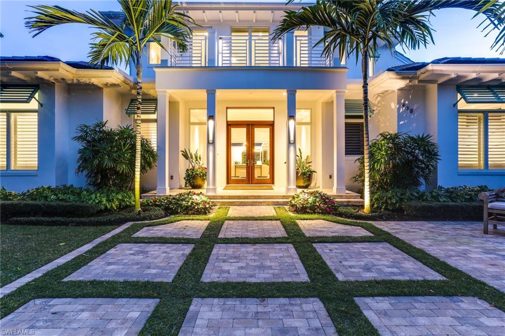 Located just blocks away from Naples' beautiful beaches, as well as downtown 5th Avenue restaurants and shopping, this 2016 custom built home displays casual elegance. An abundance of lush landscaped green space and interior natural light, combined with top of the line finishes, makes this a truly spectacular Olde Naples residence. The first floor master suite boasts his and hers walk in closets and morning bar, and expansive bathroom with dual vanities, ample storage, soaking tub, and marble flooring and shower. The remaining bedrooms, each with their own ensuite bathroom and temperature controls, belong to the 2nd floor alongside a loft area and balcony space to complete the upstairs. The gourmet kitchen is well equipped with Wolf gas range and dual wall ovens, Subzero refrigerator, freezer, and wine refrigerator, dual Miele dishwashers, and oversized walk-in pantry. Retractable glass doors and motorized screens in the expansive lanai let you customize your outdoor experience while relaxing by the heated salt system pool/spa. Coveted southern exposure provides a light filled outdoor space, and alley access off the rear 2 car air conditioned garage provides extra accessibility.
