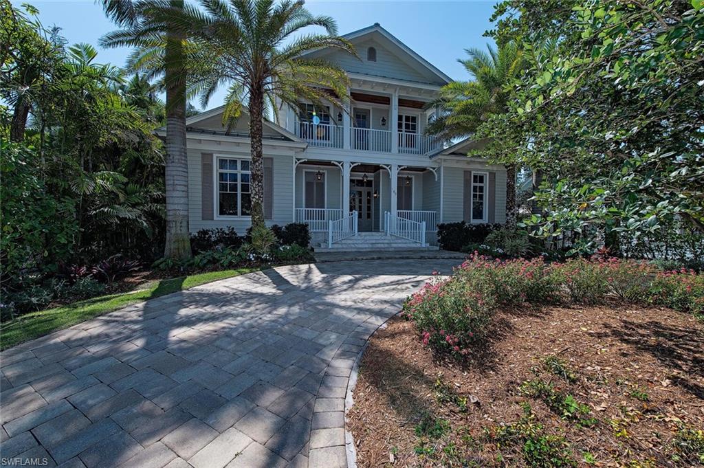 Enjoying an enviable southern exposure, and perfectly positioned just one block from the beach, this private oasis offers an incredible lifestyle opportunity. Built with the finest quality materials and boasts a stylish and elegant open-concept layout. Featuring muted color tones, high ceilings, wooden flooring, and sophisticated finishes throughout, you’ll get a sense of luxury, comfort, and privacy. In the gourmet chef’s kitchen, you’ll find Subzero and Wolf appliances, as well as sweeping stone countertops and an oversized island. From here you can move into one of the multiple living spaces that are filled with an abundance of natural light or step through the glass doors to dine alfresco on the covered entertainer’s deck. A sparkling swimming pool runs adjacent to this area, and creating a tranquil backing are established hedges and palms. Moving back inside you’ll find a beautiful home office and the master suite on the ground level that features a luxurious ensuite. There are three other bedrooms with ensuites on the upper level. A short walk from the property will have you at world-famous Naples Beach, Downtown, restaurants, and shops.