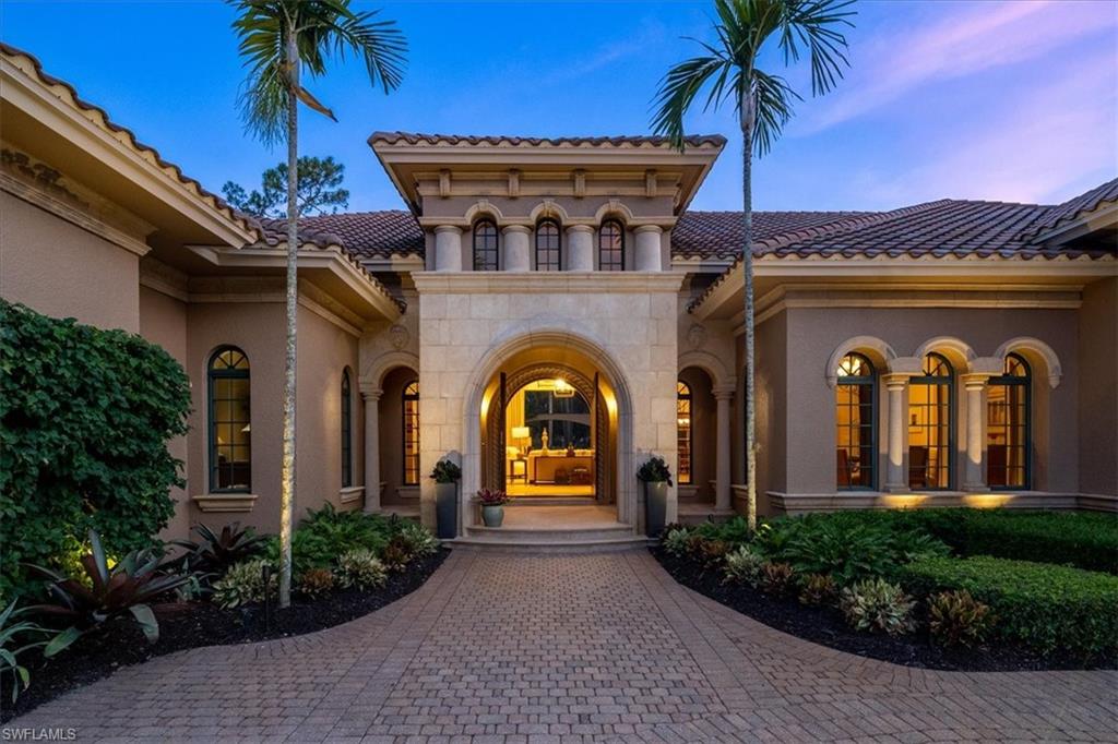 H10480 -Magnificent sprawling ranch estate home that will take your breath away. This custom-built BCB HOME boasts marble flooring on a diagonal, neutral painted walls, coffered ceilings, decorative chandeliers, and a gas fireplace with decor niches that flank the space. The family room overlooks the covered lanai, pool, and has two sets of corner fully pocketing sliders, allowing for plenty of natural light to flood the space. The owner's vestibule features double doors, a large bedroom w/a sitting room & access to the rear pool area, two closets, and an extra laundry room. The spa-sized owner's bath boasts large vanities, two water closets, a walk-through shower, and a separate tub. Each guest suite is spacious, with large walk-ins featuring built-in shelving & en-suite baths. There's even a drop zone at the garage entrance and a large first-floor laundry room. Outside, you'll find a large pool with a 25' lap area and cascading spa, perfect for relaxing after a long day. There's also an outdoor fireplace, summer kitchen, bar area, and a separate pool bath. The home overlooks the golf course with southern exposure, providing stunning views year-round.