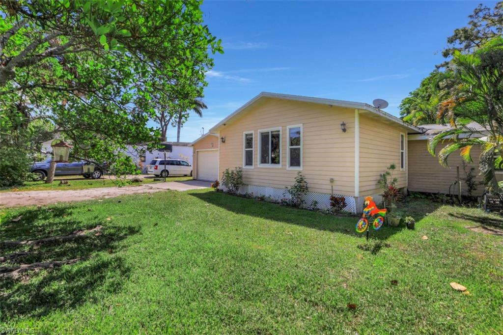 AMAZING LOCATION! Off the beaten path but so close to everything! BRAND NEW ROOF GETTING READY TO BE INSTALLED! This 3 bedroom, 2 bath, 2 car garage home is just minutes to Sanibel! New beautiful laminate flooring in the living area and hurricane impact windows! There is a small den off of the living room that is a great place to work from home, use as play room or study room.  The screened in patio takes you out to the lush, private backyard with an above ground pool. The guest bathroom has a door out to the pool area. The permitted addition added the master suite with a walk in closet, vaulted ceilings and an updated walk-in shower. Oversized 2 car garage with a 12' x 16' air conditioned room off the back that can be a 4th bedroom, fitness room, workshop, etc. This home is on central sewer and a well with a reverse osmosis system and a Culligan water softener.  The hardie board and wood siding gives this home excellent curb appeal. This is a nice private road off of McGregor with no HOA fees and no restrictions. Close to Sanibel Island Causeway, Captiva Island, Fort Myers Beach, Tanger Outlets, marinas, shopping, restaurants. Call today for your private showing.