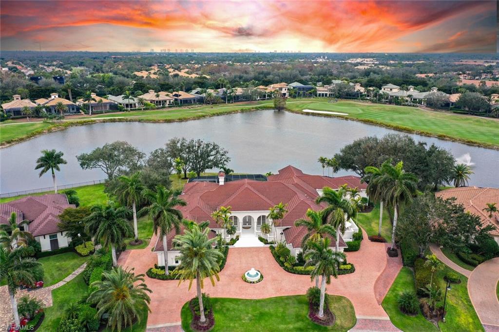 2023 talented design team completed the coolest remodel of this sprawling one story residence (6637 Sq Ft of AC living space) overlooking lake and golf course in Quail West Golf & Country Club.THE END RESULTS “ BRINGING one-of-kind elements of high finishes, designer lighting and a palette selection of materials yet allow pops of fun colors and rich textured wall coverings. High energy “VIBE” you'll instantly experience inside and out. This residence is a MUST SEE for the buyer who wants it all right now. Every room captures magnificent light with 6 sets of french doors and sliding glass doors that all open to a spectacular lanai with panoramic screen enclosure, salt water pool & spa, outside kitchen and pool bath.  Watch Football on the big projection screen theater that seats 10 (comfy oversized recliners). Entertain in grand style at curved bar that seats 5 or sit down for a meal at custom dining table in kitchen. There are 5 en-suite bedrooms with a side patio off two of the rooms and a private casita guest suite. The primary wing comes with his and her offices and his and her baths. MOVE-IN ready to start enjoying the luxurious Quail West lifestyle of a lavish 100,000 sq ft club house, locker rooms, pro shop, driving range, fitness center, Starbucks, tennis, pickle ball and a beach membership that's included. "Yes" you can have your own golf cart and TRANSFERABLE GOLF MEMBERSHIP.