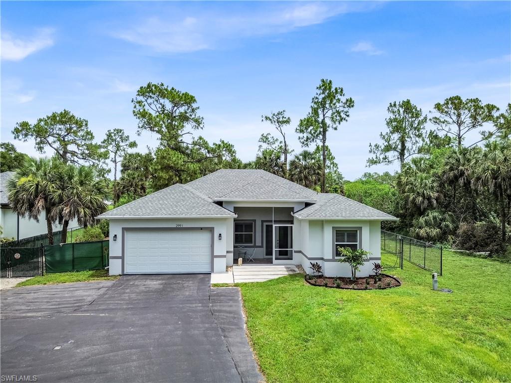 One or more photo(s) has been virtually staged, AI generated or rendered.  Built in 2021 and thoughtfully upgraded throughout, this well-designed 4-bedroom, 3-bath home is ready to move in with plenty of room on 1.59 acres with no HOA.
From the moment you arrive, the paved circular driveway, extra parking, and screened front porch create a welcoming first impression. Inside, enjoy a bright, open layout designed for easy daily living and entertaining. Tray ceilings in the living room and owner’s suite add style, while freshly painted interiors, soft-close cabinetry, and stainless-steel appliances give the home an updated feel. The kitchen flows naturally into the main living areas, making it easy to cook, gather, and enjoy time at home.
Step outside and enjoy the large, fenced backyard with partial landscaping, lighting, and a firepit area made for quiet evenings under the stars. The rear screened lanai adds even more space to relax and enjoy Florida’s year-round outdoor living.
This home also offers peace of mind with hurricane impact windows and doors, a whole-home generator hookup with included Predator 9000 generator, irrigation system, and a whole-house water treatment.
Conveniently located near shopping and dining, with everyday essentials just a short distance away. Gulf beaches such as Delnor-Wiggins Pass State Park and Vanderbilt Beach are approximately 30 minutes from the home.
Easy regional access via the nearby Vanderbilt Beach Road extension provides connectivity throughout Naples.