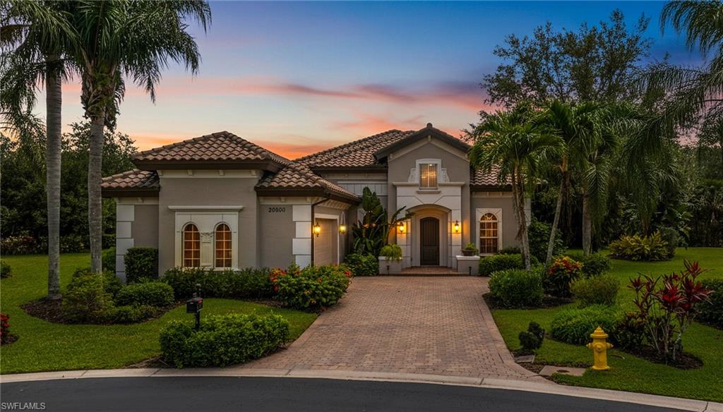 One or more photo(s) has been virtually staged, AI generated or rendered.  One or more photo(s) has been virtually staged, AI generated or rendered. Beautifully positioned at the back of Savona in Grandezza with no road noise, this freshly painted Montessa model delivers the kind of easy Southwest Florida lifestyle buyers love, complete with a private cul-de-sac setting, lush upgraded landscaping, and peaceful preserve and lake views. Offering 3 bedrooms plus a den and 2 baths, the home features an open-concept great room filled with natural light, expansive sliding doors, surround sound, and effortless indoor-outdoor living that flows to the screened lanai, where the electric-heated pool and spa with AquaLink system create the perfect place for morning coffee, sunset cocktails, weekend grilling, or quiet evenings overlooking the water and preserve. Inside, easy-maintenance tile flooring runs through the main living areas, while plush carpeting adds comfort in the bedrooms. The kitchen is both functional and inviting with granite countertops, a beautiful art glass backsplash, abundant cabinet space, a walk-in pantry, a separate island with breakfast bar seating, and a casual dining area overlooking the pool. A wet bar with wine cooler adds another thoughtful touch for entertaining, while the spacious primary suite offers a relaxing retreat with a well-appointed bath featuring dual vanities and a separate soaking tub. Thoughtful upgrades throughout include crown molding surrounding coffered ceilings, tray ceilings, central vacuum, extra recessed lighting, custom ceiling fans, custom draperies and window treatments, and designer wall coverings, creating a warm, polished home that feels move-in ready and made for enjoying the best of Florida living. For those seeking a vibrant and enriching lifestyle, optional memberships expand the experience far beyond the home. Grandezza takes resort-style living to the next level with its championship 18-hole golf course, six Har-Tru tennis courts, fitness center, resort-style pool with cabana bar and grill, and multiple dining venues ranging from casual to fine dining—all within a beautifully maintained gated community. Golf memberships are available but not required. Ideally located near Miromar Outlets, Hertz Arena, Gulf Coast Town Center, RSW Airport, and just a short drive to the beaches of Bonita Springs and Naples.