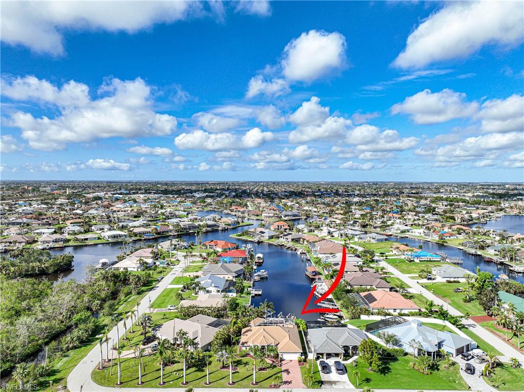 HELLO DREAM HOME! MOVE IN READY! Unique location  Unique privacy of Four Mile Eco Preserve location on an  EXTRA WIDE CANAL. No through traffic! See DOLPHINS AND MANATEES from dock. Vacation Rental potential with a possible income of $60,000 per year. NO HURRICANE DAMAGE OR FLOODING! 
Only 2 quick turns - 10 minutes to river! GREAT ROOM HAS open view of pool and wide gulf access canal. Custom cabinets and quality quartzite countertops. NEW TILE THROUGHOUT! Spacious MASTER SUITE has large walk in shower, 
separate vanities, 10x10 DEN, GUEST ROOM & JUNIOR SUITE with full bath/pool bath. 
Vaulted ceilings with 8’ doors. All IMPACT GLASS except bedrooms which have Kevlar Hurricane Screens. 
INFINITY POOL - EXTRA WIDE LANAI - Separate CABANA perfect for outdoor kitchen + big outdoor storage space. WRAP AROUND DOCK of composite decking, sitting area & boat lift. WESTERN EXPOSURE! Those SW FLORIDA SUNSETS are fantastic. NEW TILE ROOF June 2019, NEW AC Oct 2022. Freshly painted in & out. Tropical landscaping and ROW OF ROYAL PALMS. Close distance to entertainment, restaurants, shopping, worship, fitness, Midpoint Bridge to Ft Myers. Furniture and artwork negotiable!
