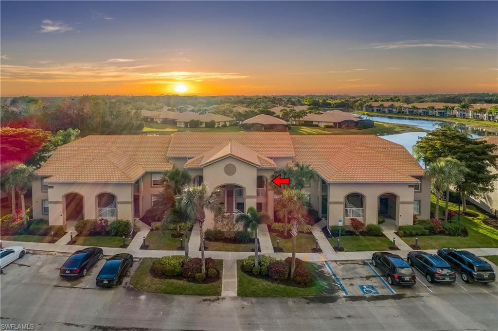 Welcome to a meticulously maintained condominium nestled in the highly sought-after resort style community of Bella Terra.  Enjoy gorgeous views of the sunset from your private balcony, facing west overlooking a large lake and preserve.  Bella Terra offers residents a wealth of amenities and recreational opportunities.  Resort-style pool, state-of-the-art fitness room, 6 pickleball courts, 2 tennis courts, 2 bocce ball courts, playground, beach volleyball, basketball, soccer field, and softball field.  Additionally, a vibrant social calendar ensures that there's never a dull moment within this community.   Conveniently located near Miromar Outlets, Florida Gulf Coast University, SWFL International Airport, and Coconut pointe mall.  This condominium comes equipped with 2 split bedrooms / 2 full bath, open floorplan, NEW AC, NEW hot water heater and in unit laundry.  Whether you're seeking a vacation retreat or an investment opportunity, this exceptional property offers both luxury and convenience in equal measure.