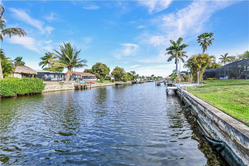 Prime Direct Gulf-Access Lot with No Bridges! Build your dream luxury home on this exceptional waterfront lot in a premier Cape Coral boating community. Western Exposure. Located in a quiet, upscale neighborhood near the fine dining and marina at Tarpon Point.