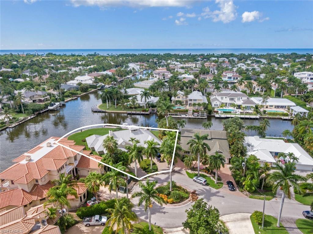 One of the most coveted locations within the Aqualane Shores neighborhood. This over sized cul-de-sac property is one street from Naples Bay. Home site is over 18,000 square feet. Deep water 100' dock recently installed. 180' seawall located on intersecting canals. The 4 bedroom + den home has newer aluminum roof and large pool/spa/water-feature. Over-sized garage. Paved circular driveway. Ride your bike to the beach, Naples pier, and Famous 5th Avenue. Existing home is ready to enjoy or build your dream home on this special Aqualane Shores property. Make from to check out the property video presentation link: https://vistabee.com/mls/4w7v2v/