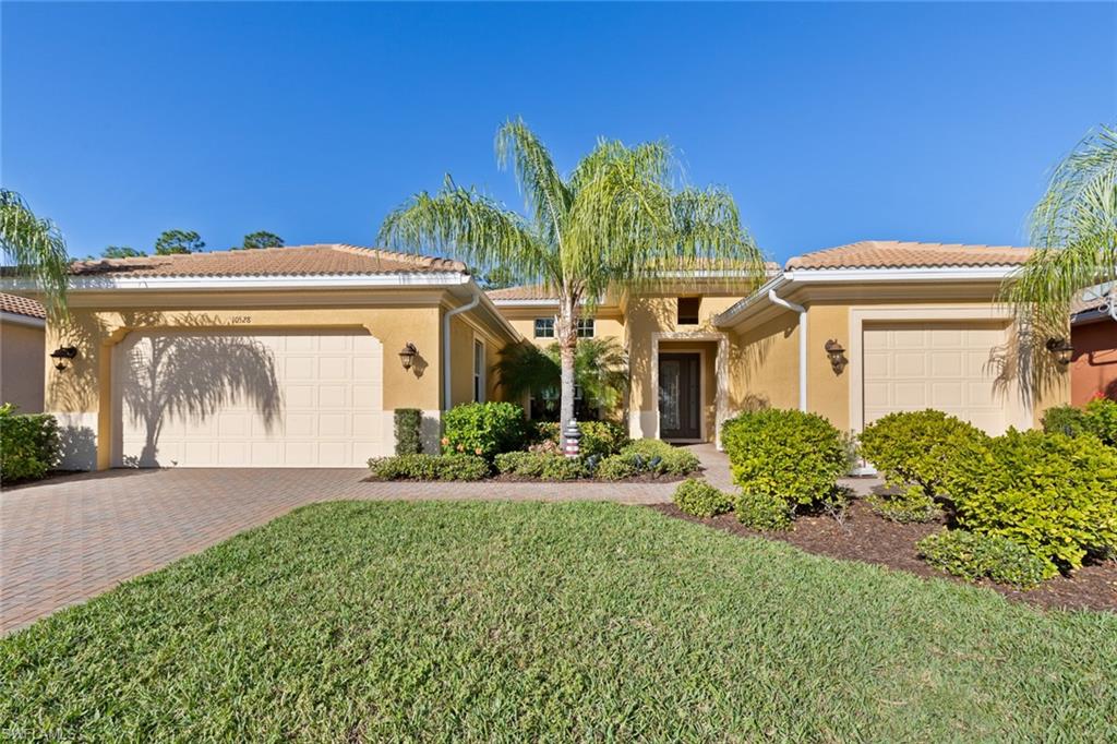 Beautiful, immaculate, Boretto model offers open floor plan, decorated in neutral tones with numerous upgrades throughout.  This home offers upgraded third garage in place of golf cart garage, situated on an extra deep partial wooded golf course lot, wall pest tubes and high impact windows.  Large tile in main areas, and crown molding throughout.  Fantastic layout for entertaining with formal dining room and kitchen open to the greatroom with large sliders leading out to the paver lanai, pool/spa and sizeable backyard.  Stainless appliances in kitchen, undermount sink, granite counter-tops, cabinetry with crown molding, breakfast bar and nook. Den with rich hardwood floors boasts closet which can be easily used as 4th bedroom.  Split bedrooms, convenient bath off the lanai.  The spacious Master suite offers vast walk-in closet and en-suite with his/her vanity, rich cabinetry with granite and large shower finished in tile.