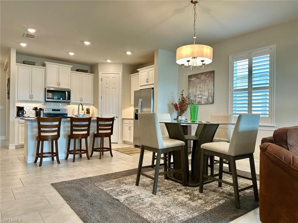 Seasonal Rental – Available Now! Gorgeous Lakeview Home! Escape to sunny Florida with this beautifully furnished seasonal rental in the gated, resort-style community of Magnolia Landing. This brand-new 2023 home offers 2 bedrooms, 2 full bathrooms, and a den with a daybed — perfect for visiting guests or a quiet reading retreat — all thoughtfully designed to provide comfort, style, and breathtaking lake views. The open concept
living space welcomes you with a bright, airy atmosphere and large windows that frame serene water views. The modern kitchen features sleek countertops, a large island, pantry, stainless steel appliances, and tile flooring, seamlessly flowing into the dining and living areas — perfect for entertaining or relaxing. The primary suite also overlooks the lake and includes a generous walk-in closet and private bath. Tile flooring runs through the main living areas, while the bedrooms are carpeted for added warmth and comfort. Magnolia Landing offers 24-hour gated and guarded access and a full suite of amenities, Golf is available on a convenient pay-as-you-play basis — no membership required, two community pools, a fully equipped fitness center, tennis, bocce, and shuffleboard courts, and a vibrant clubhouse with a restaurant, bar, and pro shop. Conveniently located near shopping, dining, and just a short drive to Fort Myers and Punta Gorda, this home is your perfect seasonal escape. Book your stay and enjoy the Florida lifestyle at its finest!