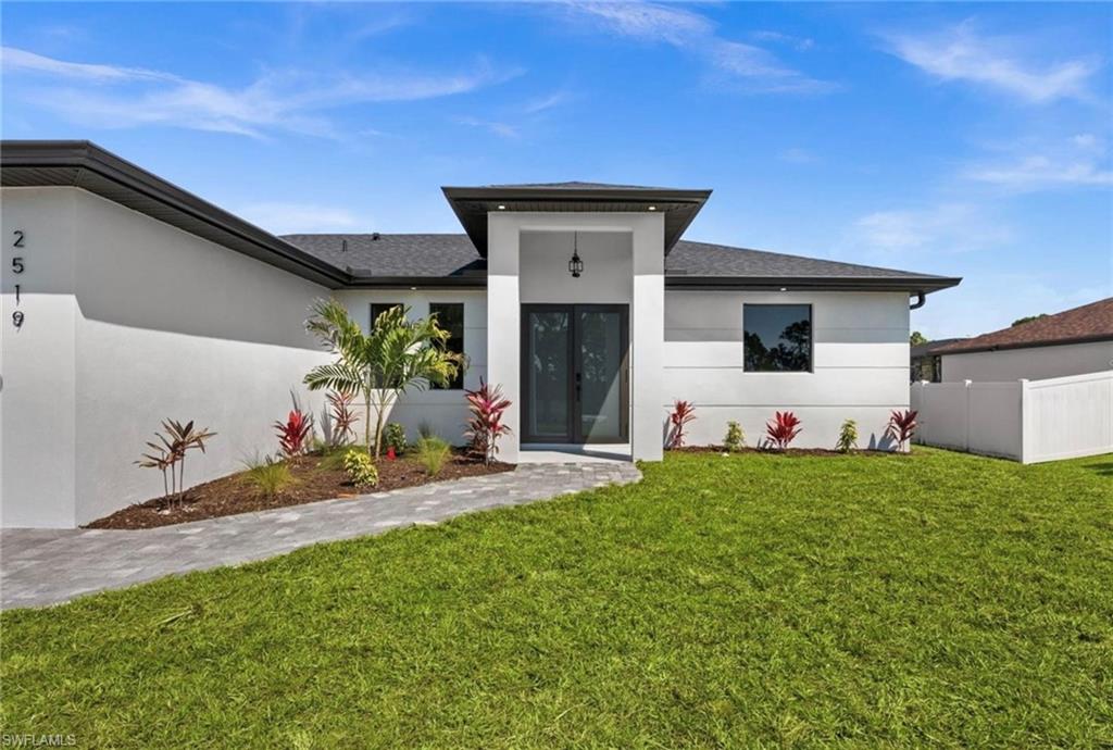 Welcome to the "Moonstone" Model. This amazing home is the perfect blend of value, comfort, luxury, style, and security. This beautiful new construction is built for everyone who wants to live with all the comforts of 'home.’ Impact windows and doors, European style kitchen featuring soft closing cabinet doors, drawers and Bloom hardware, high-end appliances, double oven, hood, cooktop, wine cooler, and much more. Master bedroom with custom designed built in walk-in closet, master en-suite with glass shower enclosure, double vanity, and linen closet. Two spacious bedrooms with walk-in closets, guest bathroom with glass shower enclosure. Home offers open concept layout with 10-foot-high interior ceilings, 8-foot-high designer doors. Outdoor kitchen with marble countertops and 1/2 bath by the pool, ready for enjoyment 12' x 24' beautiful pool with Sun Ledge, 2 car garage, washer, dryer, and laundry sink. "NO FLOOD INSURANCE NEEDED". Engulf in the multitude of upscale details that you must see to appreciate. Enjoy your day by the pool or explore everything Cape Coral has to offer. Do not miss out on this one-of-a-kind opportunity! Schedule your showing today and make this beauty your home!