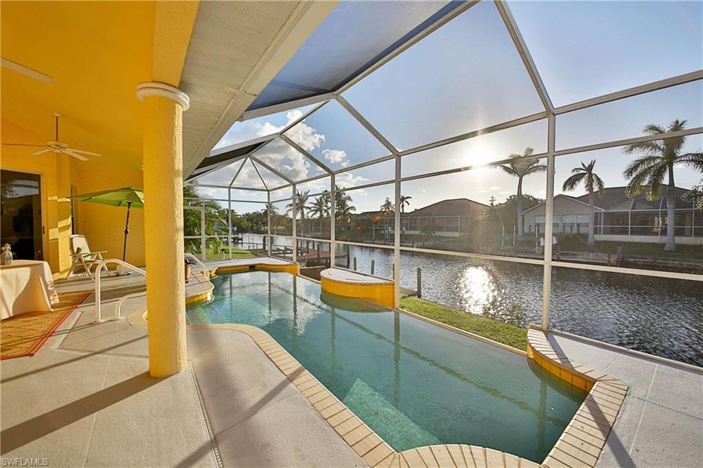 This custom home in the desirable Pelican area is just stunning!! Elegantly designed European style home features marbled tile throughout, high cathedral ceilings, and 12' tall sliding doors that disappear affording you an open view to the lovely infinity edge pool and spa.  This 3 bedroom 3 bath gulf access home was designed to be energy efficient as well as breathtaking. Double entry doors open to a large great room with grand columns, and formal dining area that overlooks the water.  Master Suite features high ceilings, his and her vanities, and separate tub and shower. Home was constructed with many more extra features including additional recessed lighting, tile roof, impact resistant windows, and is designed to be wheelchair accessible. Western exposure gives you evenings on the lanai with a cool drink enjoying the dazzling sunset skies. Schedule your private showing and see this gorgeous home for yourself!