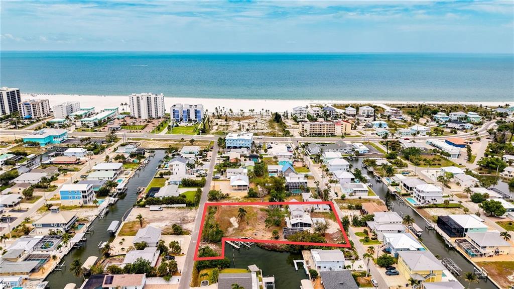 A Rare Opportunity to Acquire One of the Largest Direct Gulf-Access Waterfront Estates on Fort Myers Beach
Nestled at 175 and 191 Bahia Via, this exceptional combined parcel represents a truly singular offering the largest single-family, direct Gulf-access property currently available on the island. Spanning over an acre with remarkable waterfront presence, the possibilities here are as expansive as the views.
Envision subdividing the site to create multiple distinguished residences, crafting a private family compound, or designing your ultimate dream beach home. The existing structure offers potential for thoughtful renovation and modernization, while the grounds provide a pristine canvas for new construction. (Prospective buyers are encouraged to conduct their own due diligence regarding subdivision and development opportunities.)
The property boasts impressive amenities, including a refreshing swimming pool, 309 feet of seawall frontage along a protected basin, multiple docks, and two boat lifts, all ensuring effortless Gulf access. Just a short stroll or bike ride away, you’ll find pristine white-sand beaches, vibrant restaurants, entertainment venues, and everyday conveniences. This is more than a property, it is a rare and one-of-a-kind waterfront legacy on Fort Myers Beach.