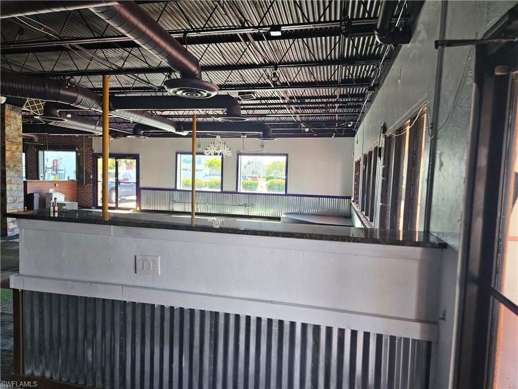 This building on US 41 directly opposite Rooms To Go with2 entrances and a median cut through.  The kitchen was updated in 2020 by former tenant and is currently occupied by a local mattress store. Just south of Colonial Blvd on the west side of US 41