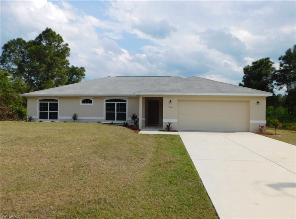 You Will Love This Professionally Remodeled 3 Bedroom/2 Bath Home On A 1/4 Acre Home Site In Lovely Lehigh Acres. The Kitchen Comes With Stainless Steel Appliances At Closing, New Tile Backsplash, Carmel Colored Real Wood Cabinets, And A Walk-In Pantry. The Large Living Room Has A Double Slider That Opens Up To The Covered Lanai With Plenty Of Room For A Pool. The Dining Area Comes With A Great View Too. The Master Bedroom Has A Large Walk-In Closet And The Master Bath Has A Walk-In Shower. Other Upgrades Include; Carpeting In All Three Bedrooms And Living Room, New Exterior Two Tone Paint, All Of The Interior Doors And Base Molding/Trim Was Just Freshly Painted, Newly Resurfaced Oversized Lanai, Newly Installed Landscaping, New Interior And Exterior Lights, Hurricane Panels, New Cage On Water Equipment, Cage On Outside AC Equipment, And A Newly Resurfaced 2 Car Garage. This Home Is Totally Move-In Ready Today! This Home Is Very Close To Major Shopping Malls, Restaurants, Schools, Parks, Golf Courses, I-75, Regional Airport, And Those White Sand Beaches Of The Gulf Of Mexico! This Is Not A Short Sale Or Bank Owned REO, You Will Have A Fast Response! Call Today For Private Showing!