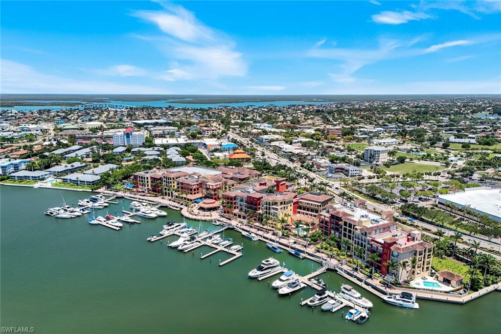 Wake up to sparkling waterfront views and end each day with unforgettable sunsets from this beautiful 3-bedroom, 2-bath residence overlooking Smokehouse Bay and The Esplanade Marina. Perfectly positioned in one of Marco Island's most desirable locations, this home offers the ideal blend of beauty, convenience, and coastal living. Enjoy watching boats go by from your private Lanai, then stroll to an array of waterfront restaurants, boutique shops and everyday conveniences--all just moments from your door. Whether you're searching for a year-round residence, a seasonal getaway, or an income-producing investment, this property delivers the lifestyle buyers dream about.