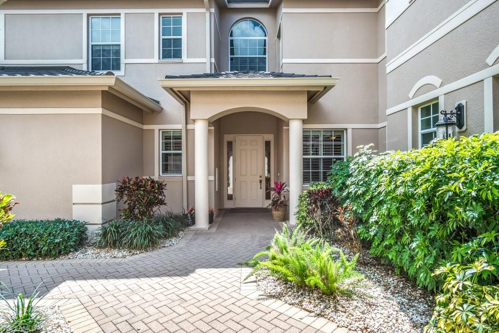 MUST SEE! BEST VIEW IN THE ENTIRE COMMUNITY! This Gorgeous First Floor End Unit features 2 Bedrooms Plus a Den, with Incredible Long Lake views, plus a massive Covered and Screened Lanai.  This Light, Bright, and Airy Luxury Designer Appointed Home comes complete with Stainless Steel Appliances, Upgraded Cabinets, Granite Countertops, Crown Molding throughout, a Bay Window Breakfast Nook, Separate Dining Area overlooking the tranquil lake fountain and the most BREATHTAKING SUNSETS! Situated at the end of a quiet street and including a Large 2-Car Attached Garage, you are just steps away from the amazing Regency Reserve Community Pool & Clubhouse.  All Furniture is Negotiable.  VINEYARDS is one of the most desirable communities in Naples and in Southwest Florida.  Golf Memberships are OPTIONAL for owners at Vineyards Country Club, which is one of this city’s largest, most unique, and remarkable Country Clubs with two award-winning, 18-hole championship golf courses set on 300-acres of unmatched experiences for golf, wellness, fine dining, social events and more.